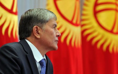 Atambayev with Kyrgyz flags