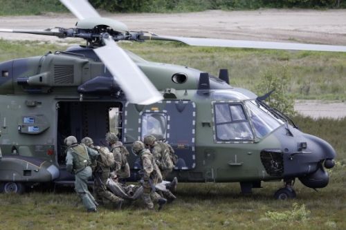 German-armed-forces-solders-run-with-an-injured-comrade-to-a-German-Air-Force