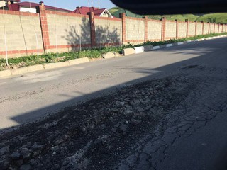Отремонтированная в 2016 году дорога в селе Орто-Сай начала разрушаться, - читатель <i>(фото)</i>