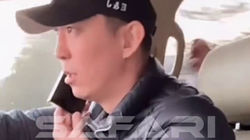 Депутат Эрулан Кокулов едет за рулем и разговаривает по телефону. Видео